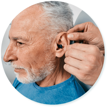 Man getting his hearing aid fitted
